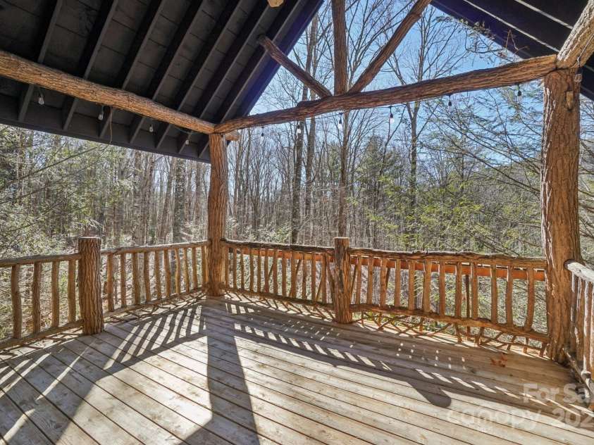 102 Knobster Way, Glenville, NC 28736.  MLS# CAR4325693, YatesRealty ID 3776. Covered for year-round relaxing or entertaining, 