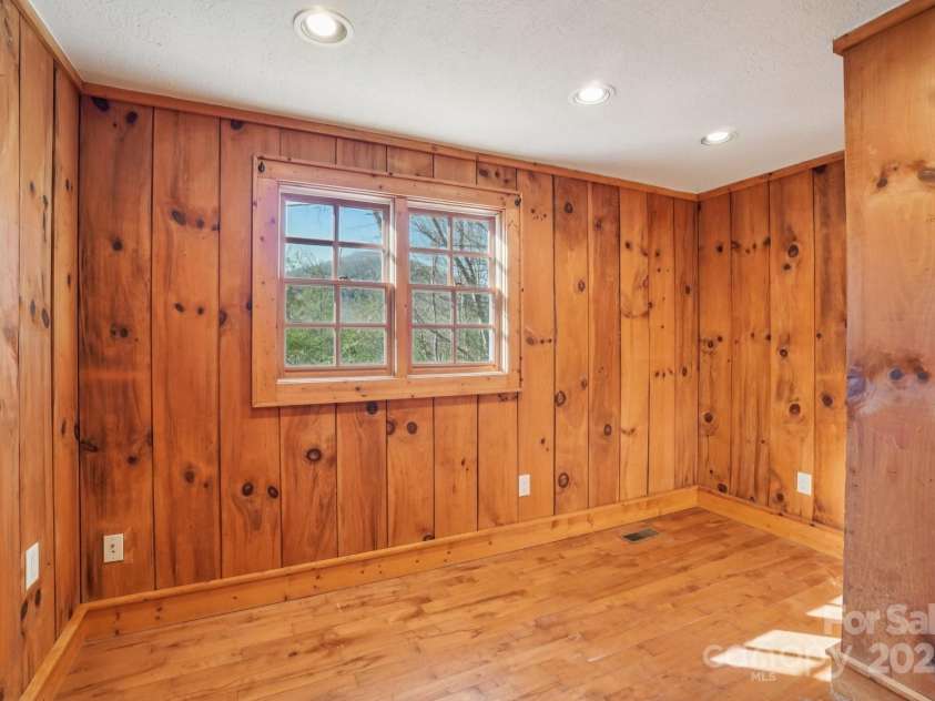 102 Knobster Way, Glenville, NC 28736.  MLS# CAR4325693, YatesRealty ID 3776. Enter the smaller of two upstairs bedrooms.