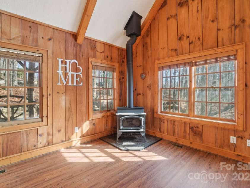 102 Knobster Way, Glenville, NC 28736.  MLS# CAR4325693, YatesRealty ID 3776. Large paneled windows allow for year-round views.