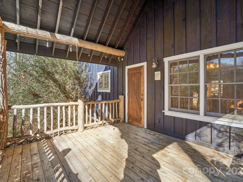 102 Knobster Way, Glenville, NC 28736.  MLS# CAR4325693, YatesRealty ID 3776. Off the rear of the family room is a spacious deck.