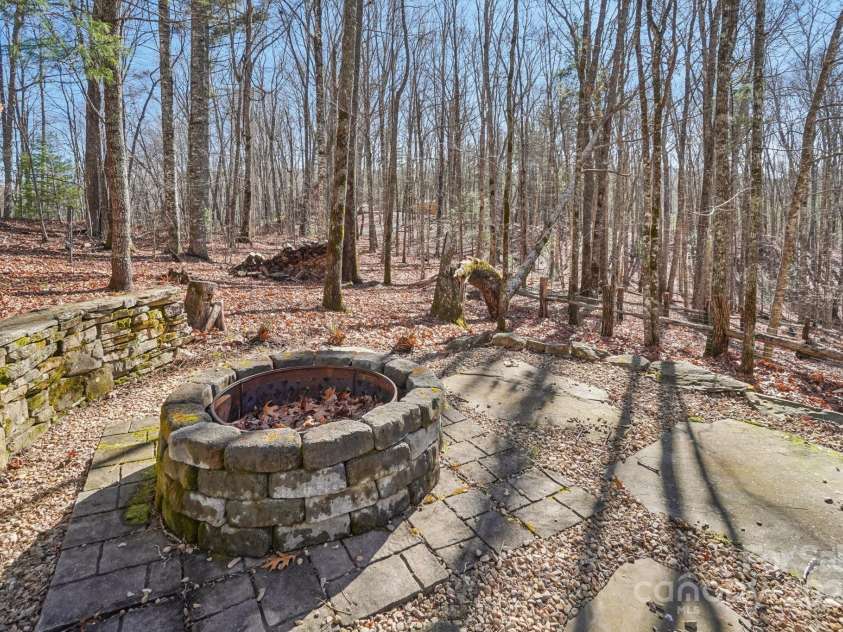 102 Knobster Way, Glenville, NC 28736.  MLS# CAR4325693, YatesRealty ID 3776. Outside features include: a fire pit in front of the house,