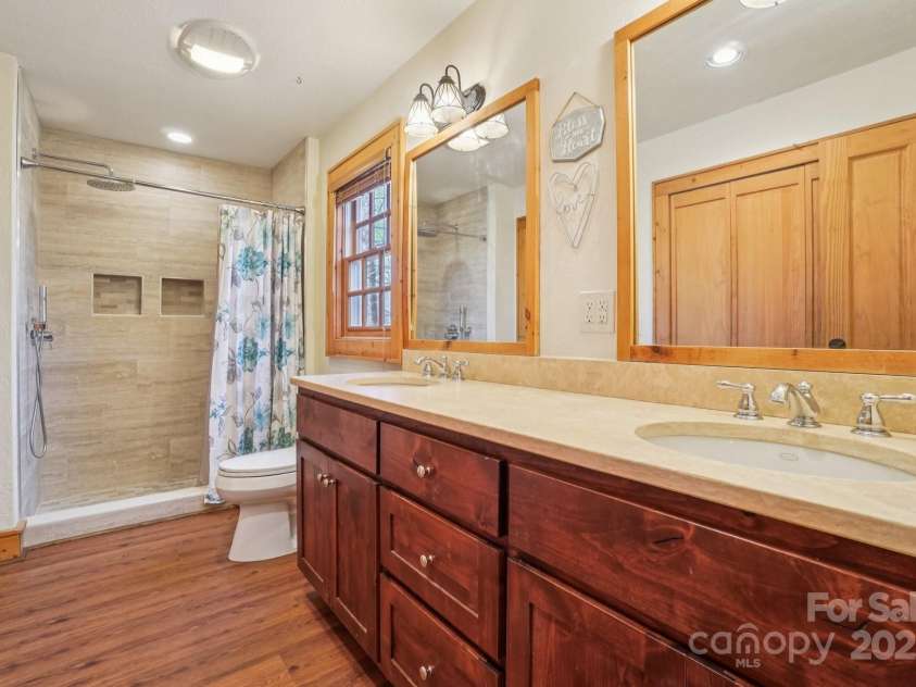 102 Knobster Way, Glenville, NC 28736.  MLS# CAR4325693, YatesRealty ID 3776. Pass through to the main bathroom, which