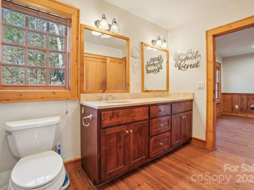 102 Knobster Way, Glenville, NC 28736.  MLS# CAR4325693, YatesRealty ID 3776. This main level bath connects