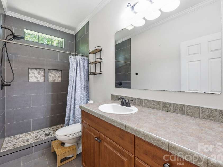 16665 Stokes Ferry Road, Richfield, NC 28137.  MLS# CAR4400480, YatesRealty ID 37796. Freshly updated second bathroom with tiled shower