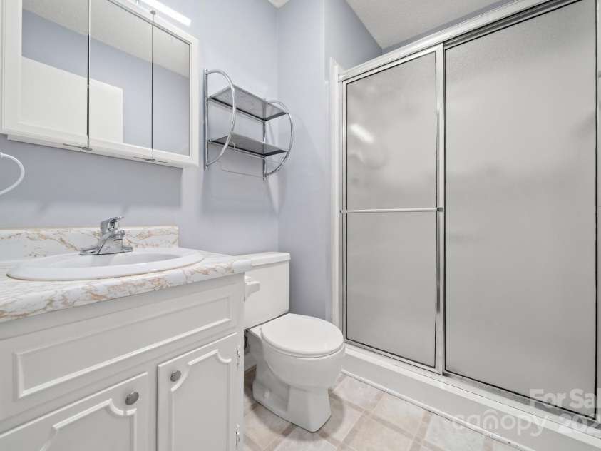 27 Capri Lane, Hendersonville, NC 28791.  MLS# CAR4323104, YatesRealty ID 378. Guest Bath