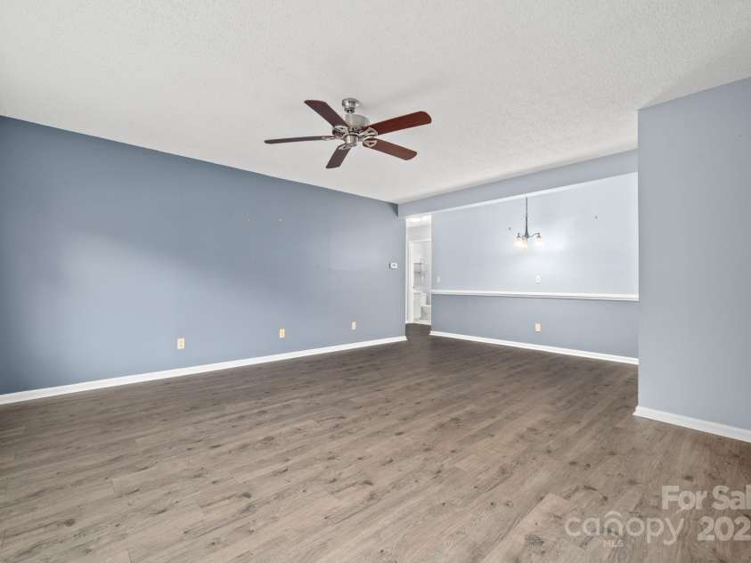 27 Capri Lane, Hendersonville, NC 28791.  MLS# CAR4323104, YatesRealty ID 378. Living Room/Dining Area