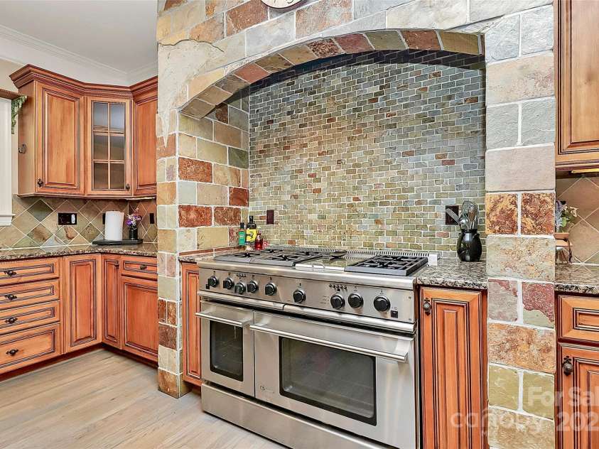 227 Wildwood Cove Drive, Mooresville, NC 28117.  MLS# CAR4214426, YatesRealty ID 3780. 48” GE Monogram Range/Dual Oven