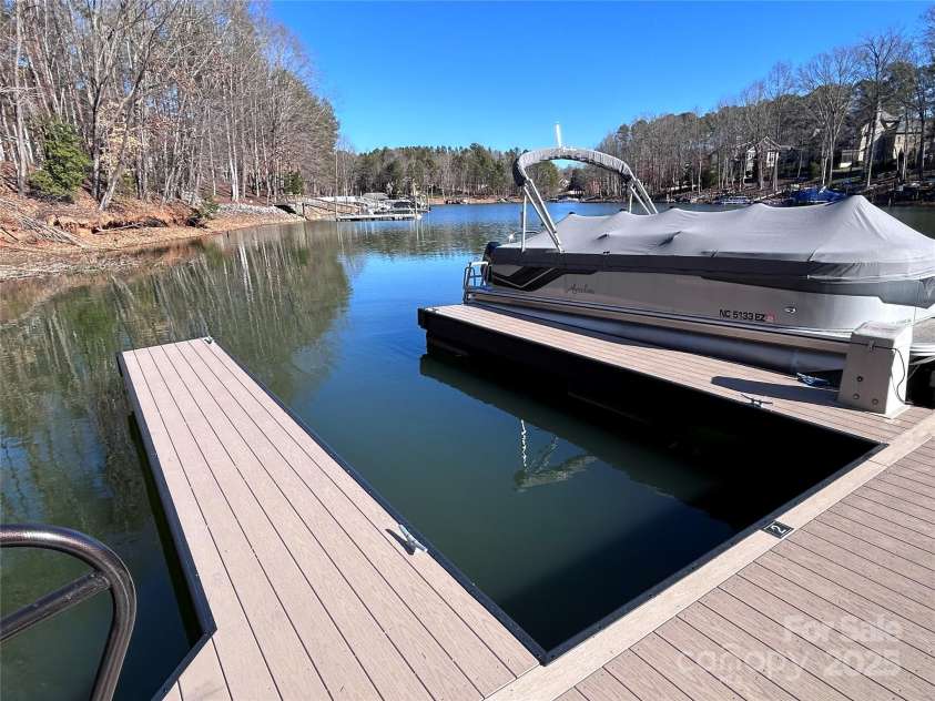 227 Wildwood Cove Drive, Mooresville, NC 28117.  MLS# CAR4214426, YatesRealty ID 3780. Boat Slip is the first on the left