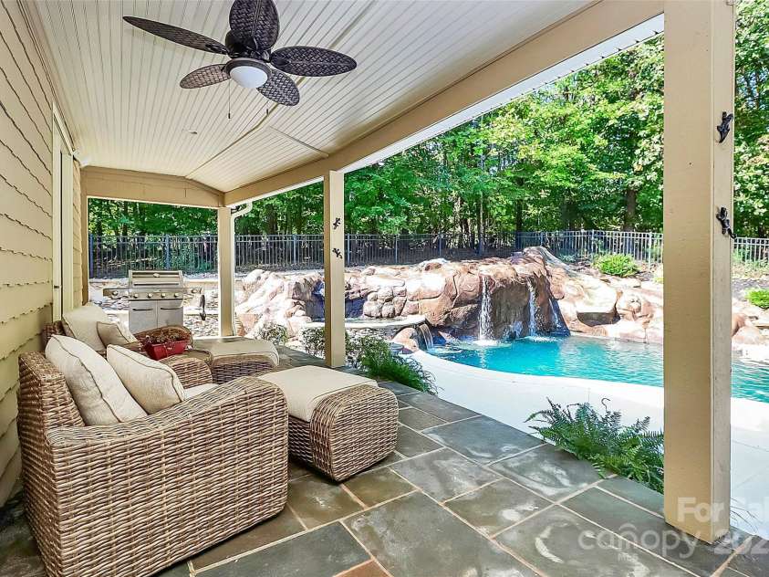 227 Wildwood Cove Drive, Mooresville, NC 28117.  MLS# CAR4214426, YatesRealty ID 3780. Covered back porch