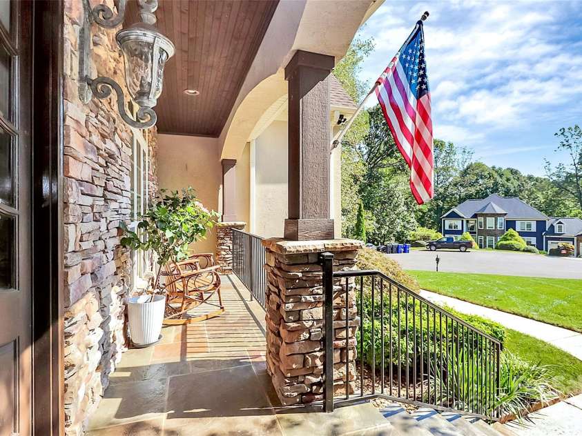 227 Wildwood Cove Drive, Mooresville, NC 28117.  MLS# CAR4214426, YatesRealty ID 3780. Covered front porch with LKN views