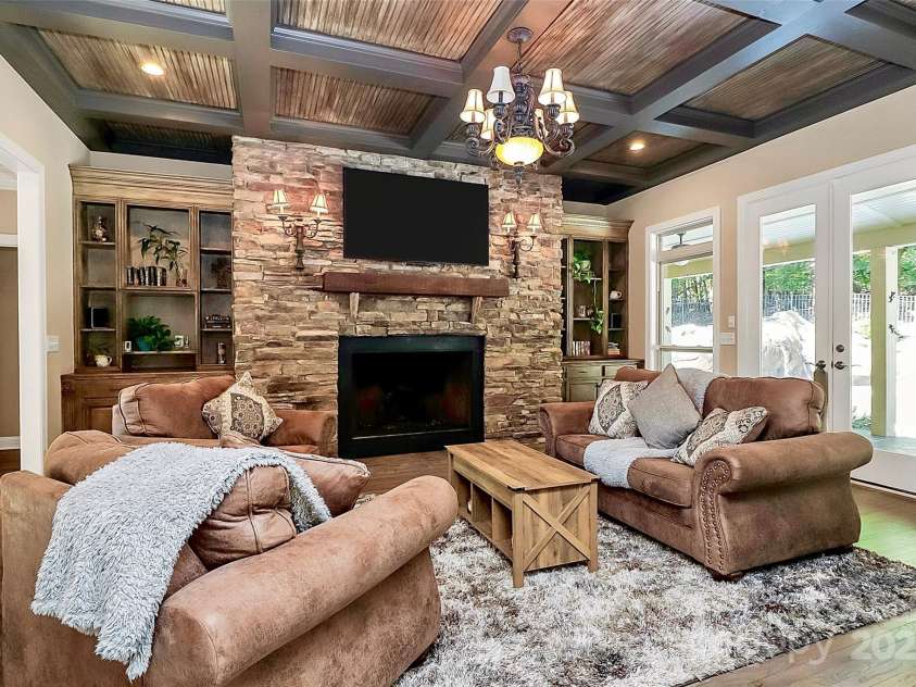 227 Wildwood Cove Drive, Mooresville, NC 28117.  MLS# CAR4214426, YatesRealty ID 3780. Cozy up to with the fp and built-in bookcases