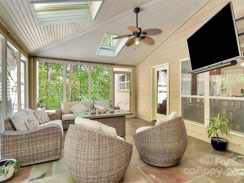 227 Wildwood Cove Drive, Mooresville, NC 28117.  MLS# CAR4214426, YatesRealty ID 3780. Enjoy coffee, the game, or just relaxing on your screened porch