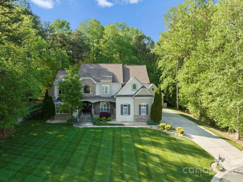 227 Wildwood Cove Drive, Mooresville, NC 28117.  MLS# CAR4214426, YatesRealty ID 3780. Executive home sits back on a private, cul-de-sac lot.