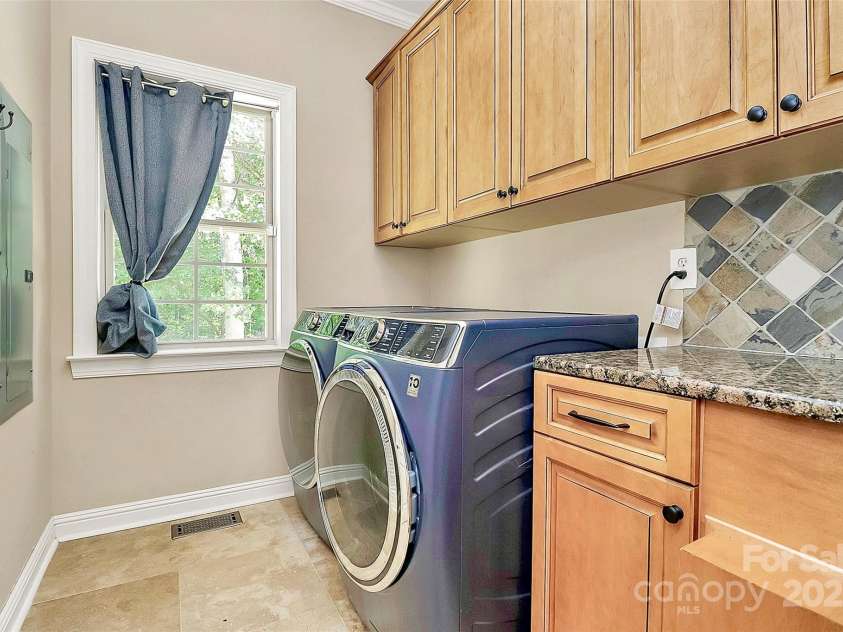 227 Wildwood Cove Drive, Mooresville, NC 28117.  MLS# CAR4214426, YatesRealty ID 3780. Laundry room on main floor