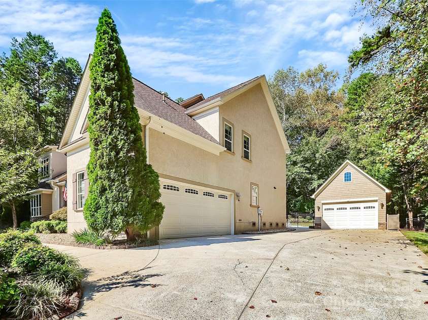 227 Wildwood Cove Drive, Mooresville, NC 28117.  MLS# CAR4214426, YatesRealty ID 3780. Long driveway, and dual garages