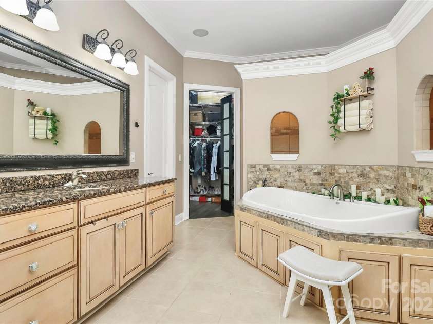 227 Wildwood Cove Drive, Mooresville, NC 28117.  MLS# CAR4214426, YatesRealty ID 3780. Spa-like bathroom w/dual vanities