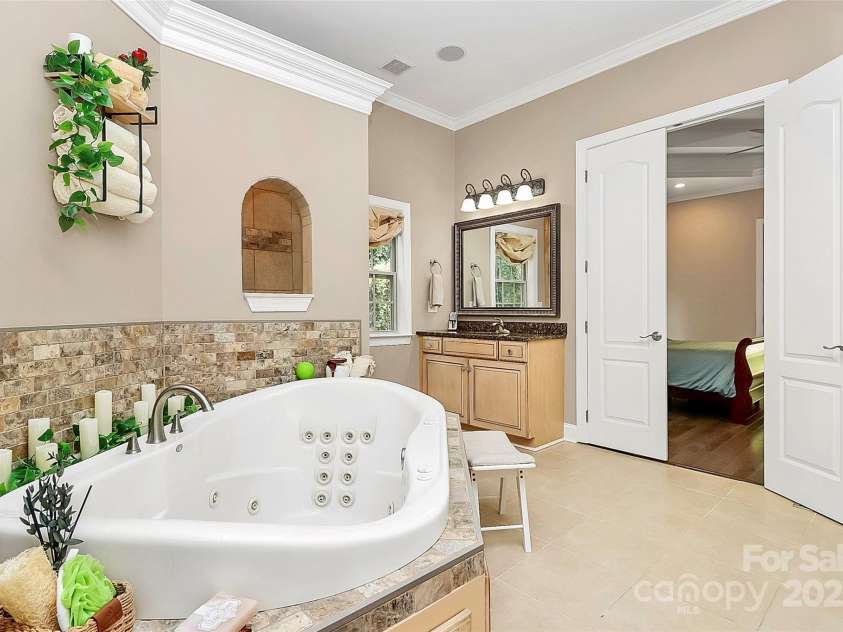 227 Wildwood Cove Drive, Mooresville, NC 28117.  MLS# CAR4214426, YatesRealty ID 3780. There are 28 jets in this tub!