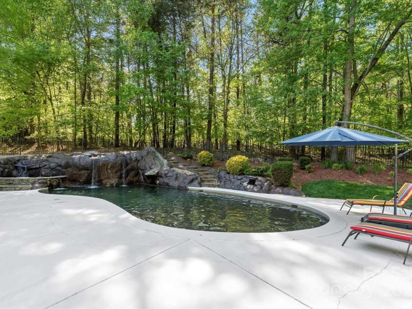227 Wildwood Cove Drive, Mooresville, NC 28117.  MLS# CAR4214426, YatesRealty ID 3780. This private lot allows you to truly relax