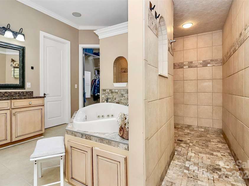 227 Wildwood Cove Drive, Mooresville, NC 28117.  MLS# CAR4214426, YatesRealty ID 3780. Walk-thru shower