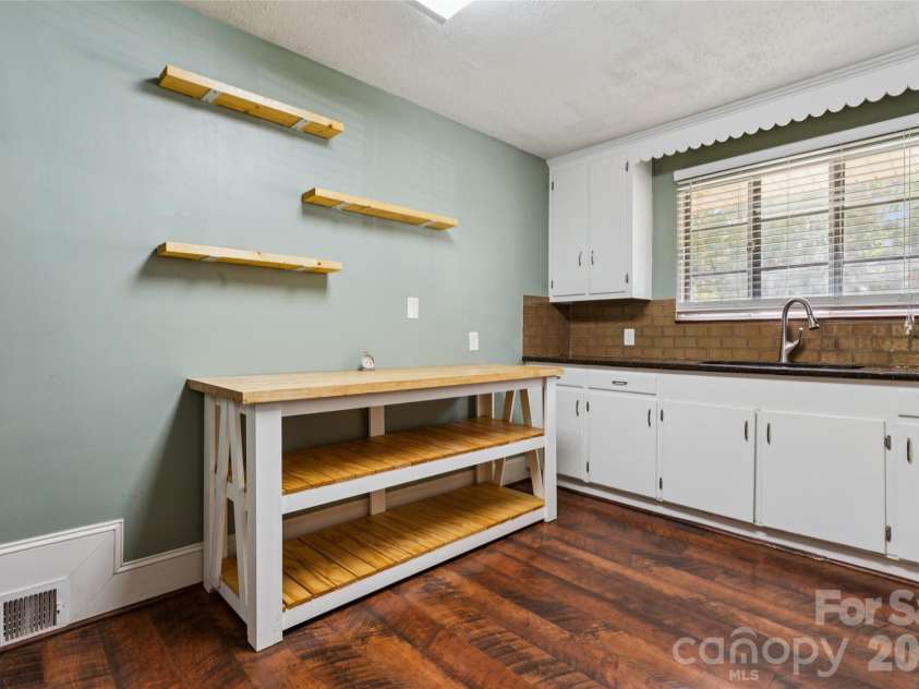 116 Maye Street, Wingate, NC 28174.  MLS# CAR4400277, YatesRealty ID 37804. Granite counters and tile backsplash