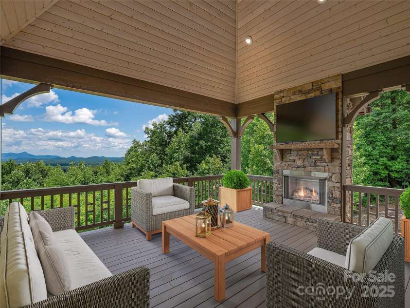 527 Falkirk Way, Zirconia, NC 28790.  MLS# CAR4231554, YatesRealty ID 3781. Cozy back deck with fireplace and plumbed for an outdoor kitchen!