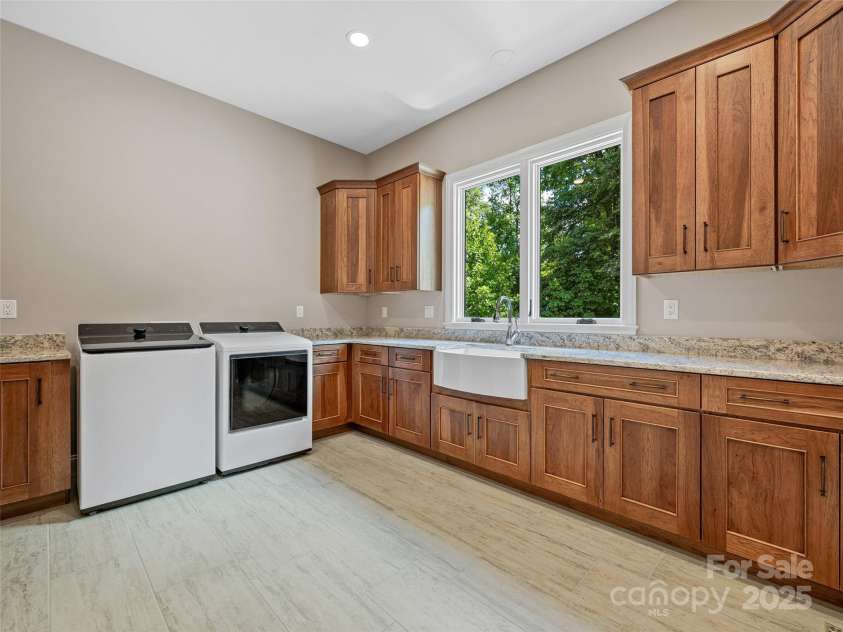 527 Falkirk Way, Zirconia, NC 28790.  MLS# CAR4231554, YatesRealty ID 3781. Main Level Laundry ROom with large closet