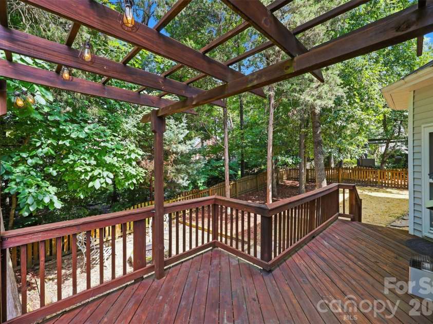 6832 Charter Hills Road, Charlotte, NC 28277.  MLS# CAR4396784, YatesRealty ID 37813. Spacious back deck with a pergola for entertaining!