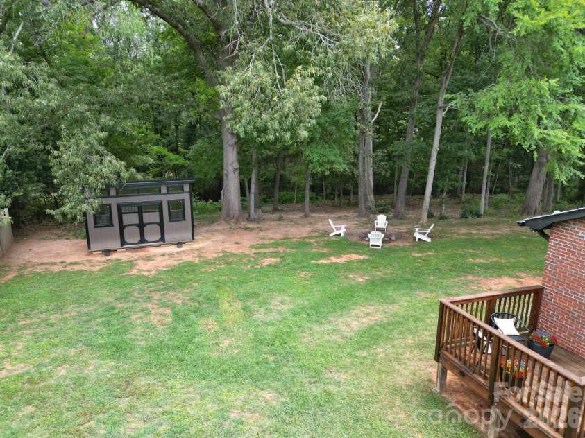2406 Bearskin Lane, Monroe, NC 28110.  MLS# CAR4396948, YatesRealty ID 37817. Backyard, Firepit, Shed and Side Deck