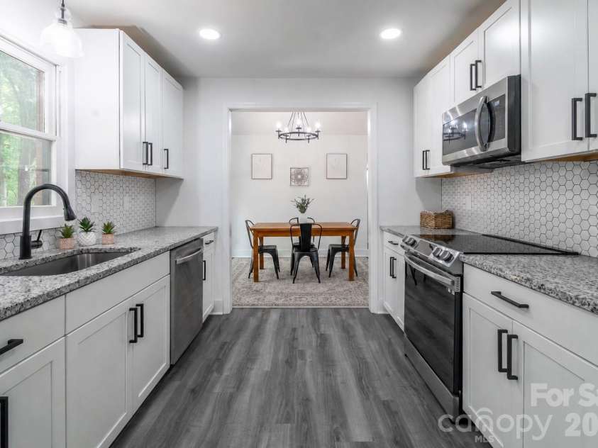 2406 Bearskin Lane, Monroe, NC 28110.  MLS# CAR4396948, YatesRealty ID 37817. Beautifully updated Kitchen open to Dining Area