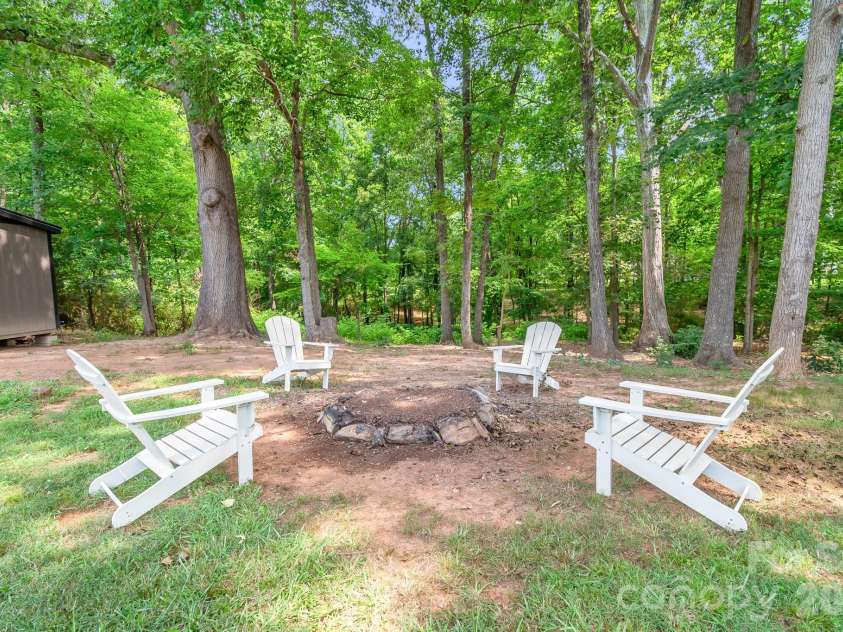 2406 Bearskin Lane, Monroe, NC 28110.  MLS# CAR4396948, YatesRealty ID 37817. Firepit
