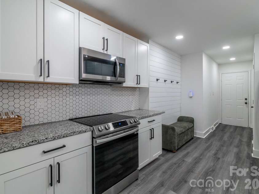 2406 Bearskin Lane, Monroe, NC 28110.  MLS# CAR4396948, YatesRealty ID 37817. Kitchen next to Drop Zone