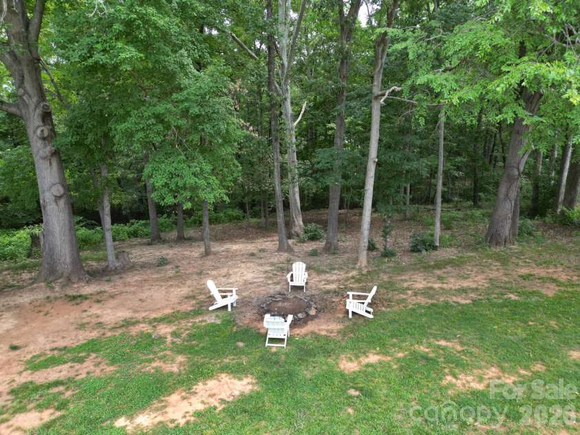 2406 Bearskin Lane, Monroe, NC 28110.  MLS# CAR4396948, YatesRealty ID 37817. Large Back Yard with Firepit