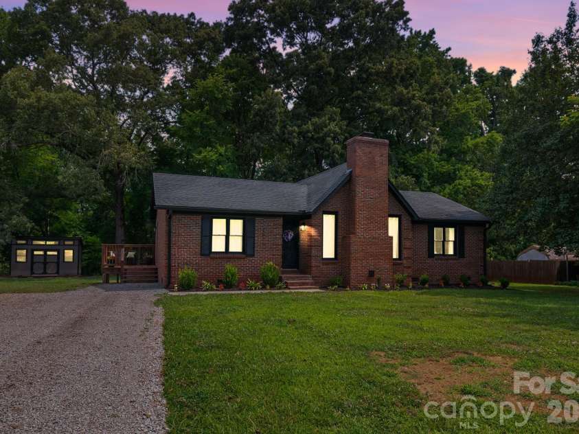 2406 Bearskin Lane, Monroe, NC 28110.  MLS# CAR4396948, YatesRealty ID 37817. Twilight of this Charming Brick Ranch!