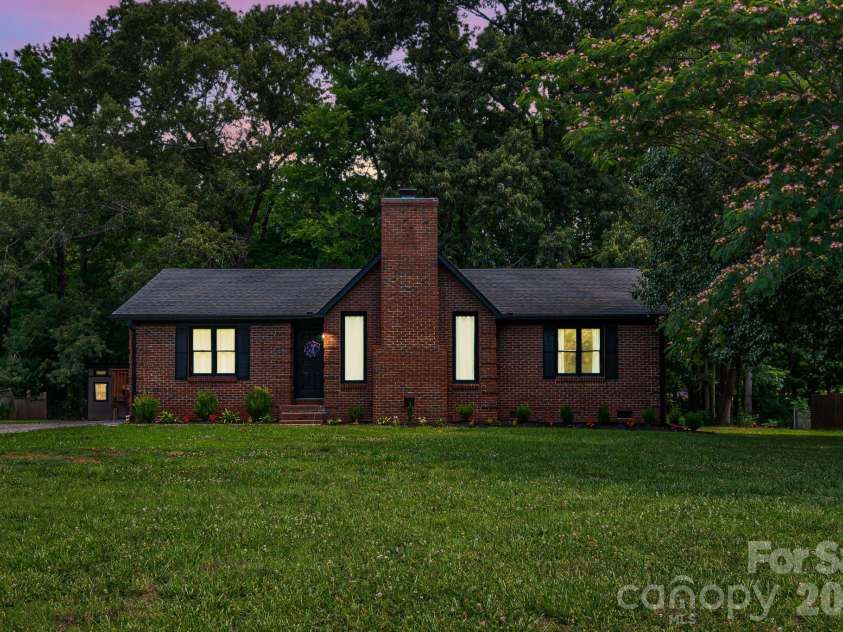 2406 Bearskin Lane, Monroe, NC 28110.  MLS# CAR4396948, YatesRealty ID 37817. Twilight of this Charming Brick Ranch!
