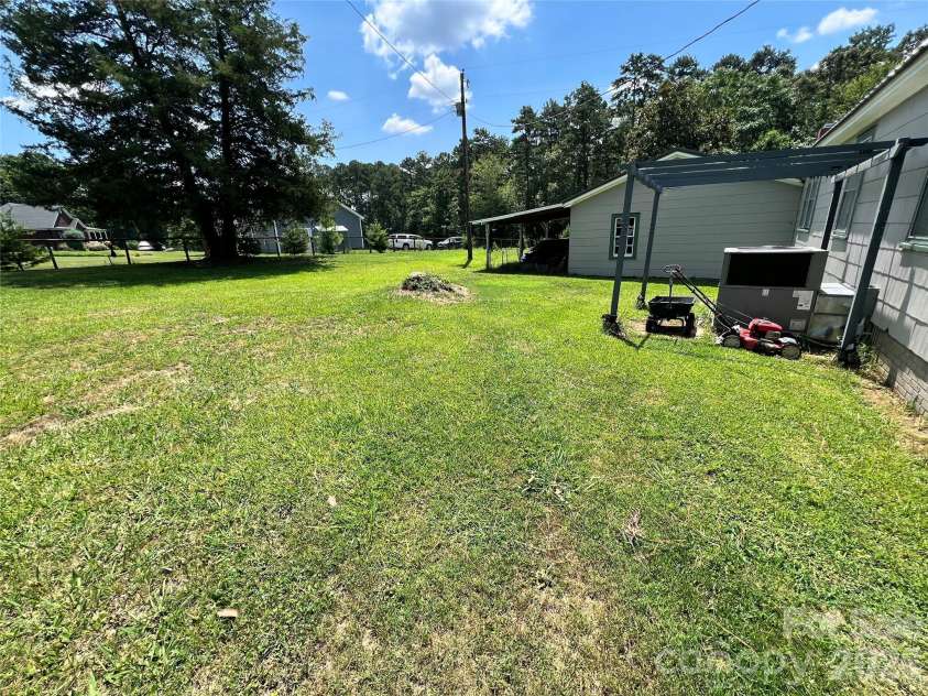 24520 Ridgecrest Road, Locust, NC 28097.  MLS# CAR4404798, YatesRealty ID 37819. Back Yard