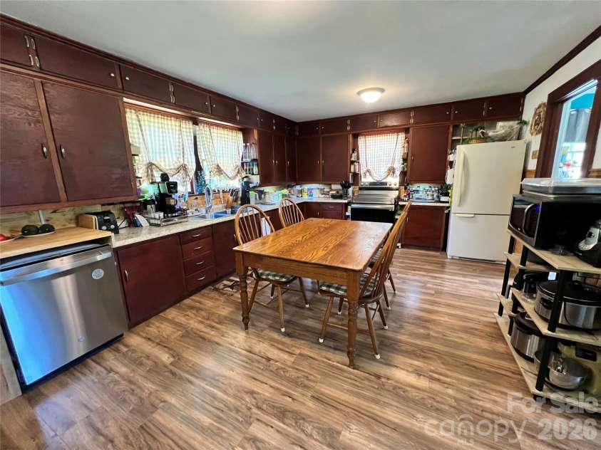 24520 Ridgecrest Road, Locust, NC 28097.  MLS# CAR4404798, YatesRealty ID 37819. Kitchen and Dining Area