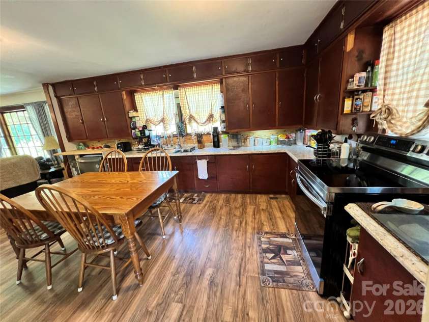 24520 Ridgecrest Road, Locust, NC 28097.  MLS# CAR4404798, YatesRealty ID 37819. Kitchen and Dining Area