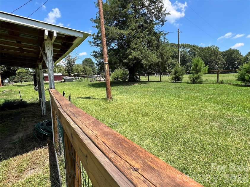 24520 Ridgecrest Road, Locust, NC 28097.  MLS# CAR4404798, YatesRealty ID 37819. Rear Fenced Yard