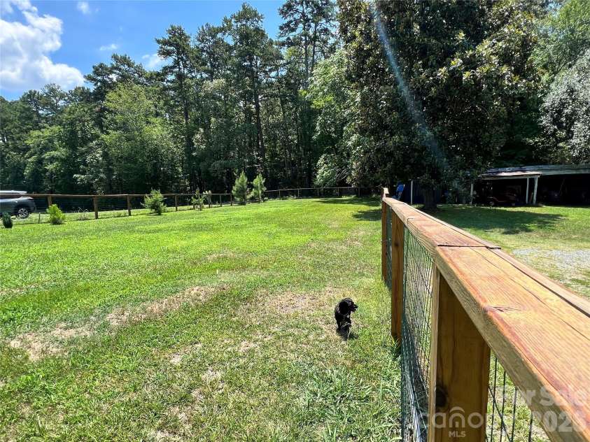24520 Ridgecrest Road, Locust, NC 28097.  MLS# CAR4404798, YatesRealty ID 37819. Rear Fenced Yard