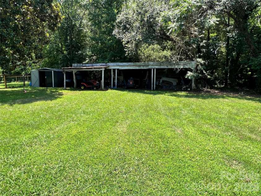 24520 Ridgecrest Road, Locust, NC 28097.  MLS# CAR4404798, YatesRealty ID 37819. Storage Shed - Open Shed