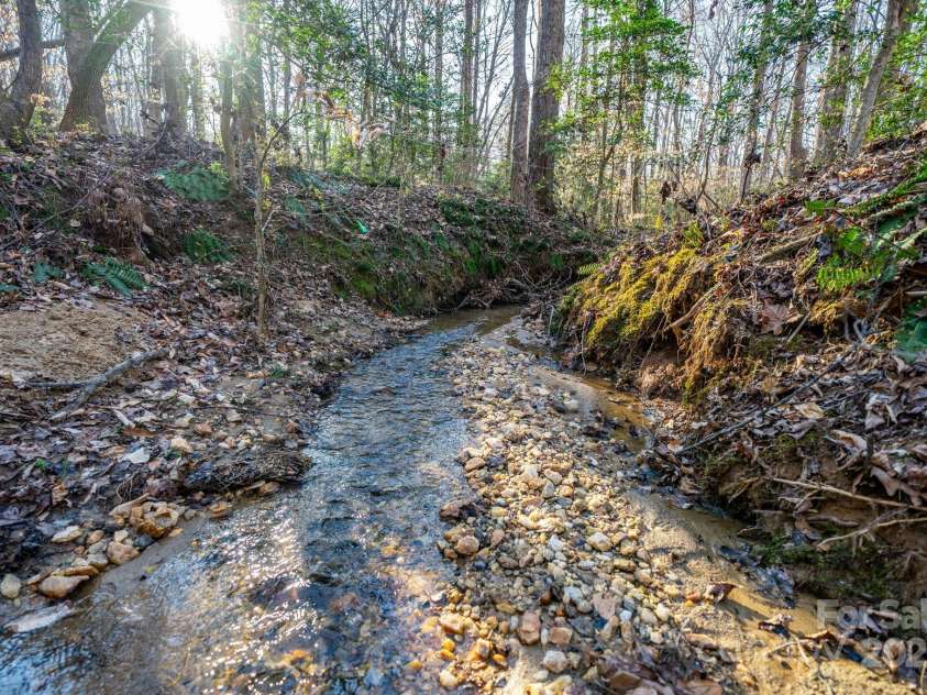 6118 Fox Gap Street, Morganton, NC 28655.  MLS# CAR4228074, YatesRealty ID 3786. Seller says these creeks were used to bring gold off the mountain.