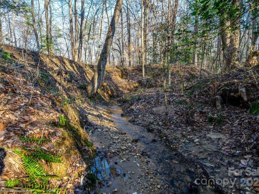 6118 Fox Gap Street, Morganton, NC 28655.  MLS# CAR4228074, YatesRealty ID 3786. Seller says these creeks were used to bring gold off the mountain.