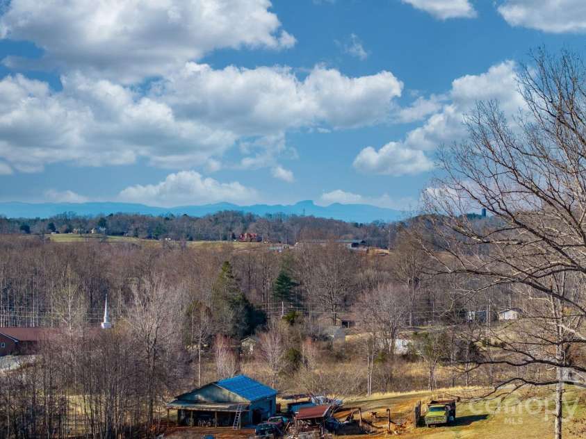 6118 Fox Gap Street, Morganton, NC 28655.  MLS# CAR4228074, YatesRealty ID 3786. Views of Table Rock and Shortoff from property.