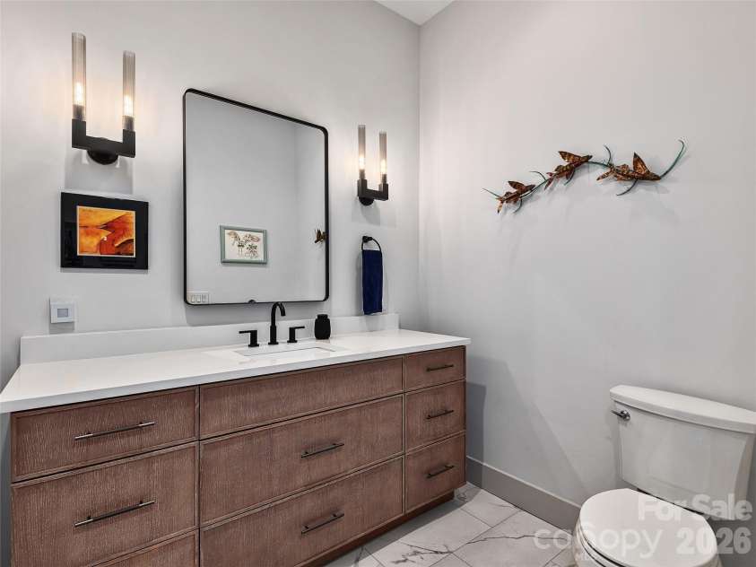 696 Daniel Circle Drive, Mills River, NC 28759.  MLS# CAR4402864, YatesRealty ID 37864. Convenient Powder Room off the Kitchen and Garage