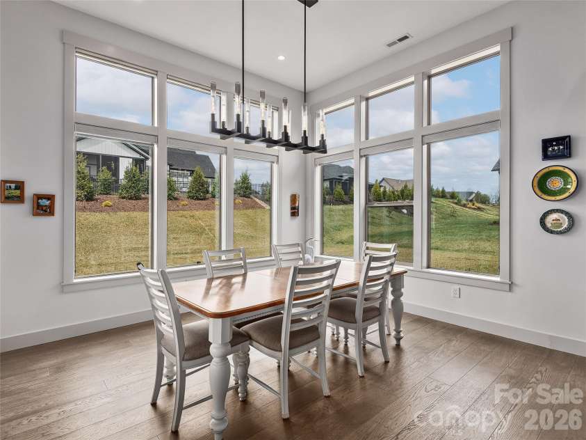 696 Daniel Circle Drive, Mills River, NC 28759.  MLS# CAR4402864, YatesRealty ID 37864. Dining Area Overlooking Mature Landscaping