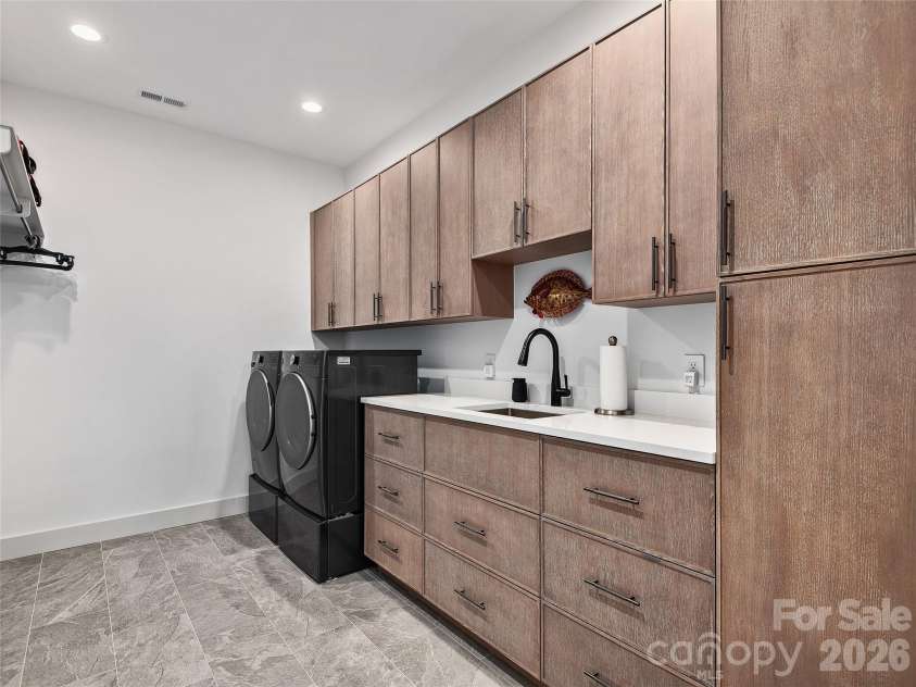 696 Daniel Circle Drive, Mills River, NC 28759.  MLS# CAR4402864, YatesRealty ID 37864. Expansive Laundry Room with Heated Flooring