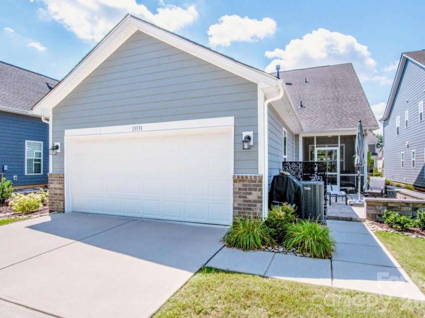 13331 Caite Ridge Road, Davidson, NC 28036.  MLS# CAR4402255, YatesRealty ID 37876. The 2 car garage features storage racks which will stay with the home