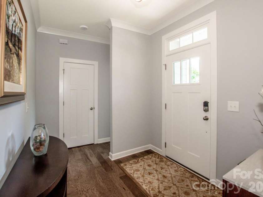 13331 Caite Ridge Road, Davidson, NC 28036.  MLS# CAR4402255, YatesRealty ID 37876. The handsome front door features a pretty transom window