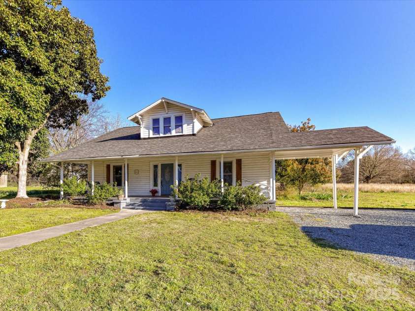 214 Elm Street, Wingate, NC 28174.  MLS# CAR4227263, YatesRealty ID 3790. Front of House/Carport