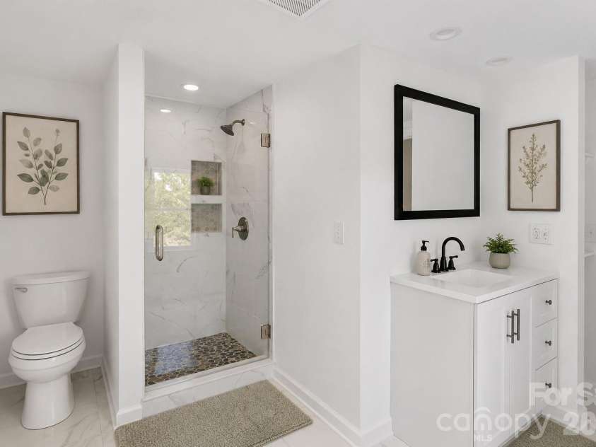 136 Wilhemenia Street, Marion, NC 28752.  MLS# CAR4404267, YatesRealty ID 37912. Virtually staged bath